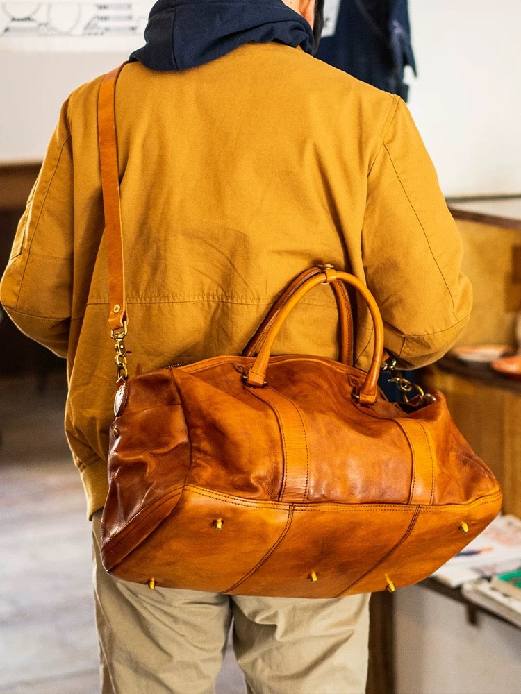 Vintage style shiny leather duffle bag